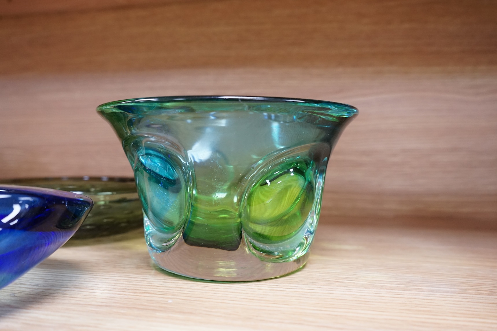 A Whitefriars green glass ‘bubble’ dish, a Costa Boda blue/green bowl and a Murano dish (3) tallest 10.5cm